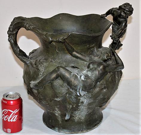 Exceptional Large Spelter 19Th C. Urn: Exceptional large Spelter 19th C. urn with cupid feeding grapes to semi nude nouveau women. Signed A. Kinsburger. Wear on the finish, consistent with age, needs a good cleaning. Estate fresh. 16" wide