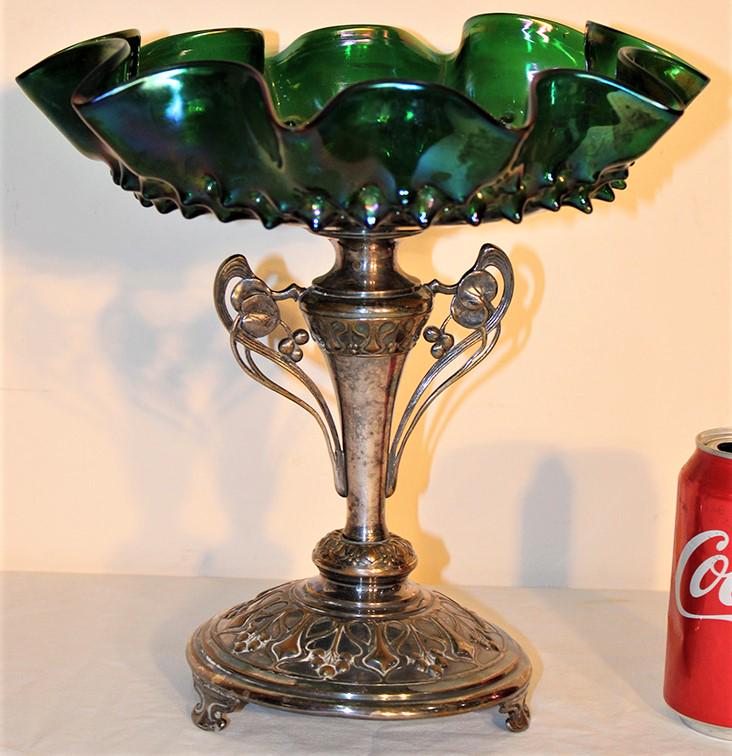 Victorian Loetz style art glass center piece with nouveau base: Victorian Loetz style art glass center piece with nouveau base all in nice condition. No chips or cracks. 11" wide, 11" tall.