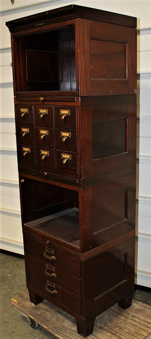 Narrow 19" wide mahogany stacking file unit: Narrow 19" wide mahogany stacking file unit original finish. A few small drawers stick. 19" wide, 62" tall, 17" deep.