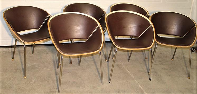 Set of 6 mid century saucer style chairs: Set of 6 mid century saucer style chairs, very heavy leather and laminated wood. High quality, has a few minor chips on the edges. 25" wide, 30" tall, 23" deep.