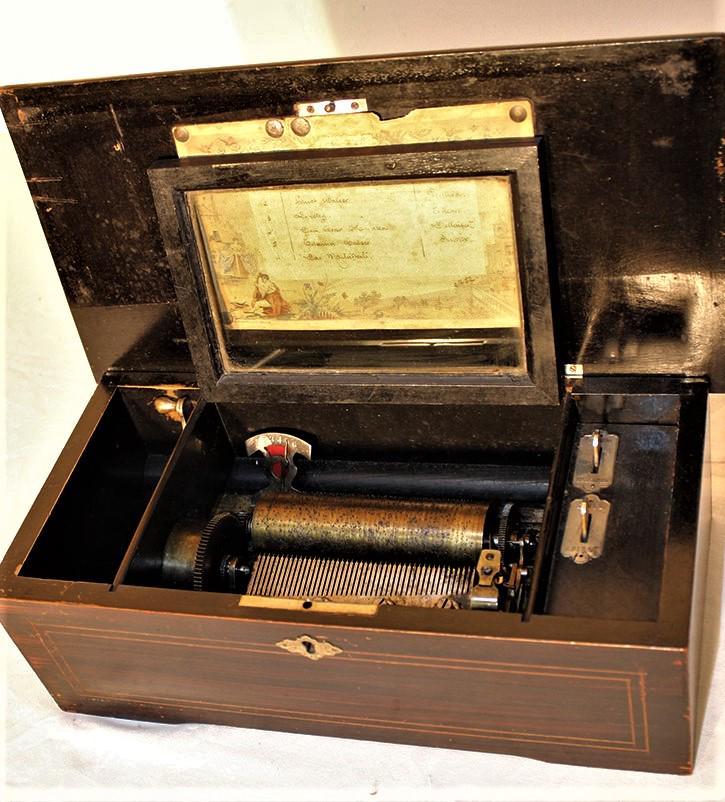 Nice small 6 tune cylinder music box: Nice small 6 tune cylinder music box. Spring and all teeth are good, doesn't work. Needs a cleaning, 5" cylinder. 14" wide, 5" tall, 8" deep.