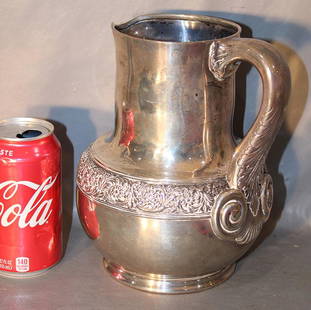 Wonderful Large Signed Tiffany & Co. Sterling Silver Pitcher And Original Bag: Wonderful large signed Tiffany & Co. sterling silver pitcher and original bag. 37 troy oz. No monograms or dents, needs polishing, estate fresh. 7" wide, 8" tall.