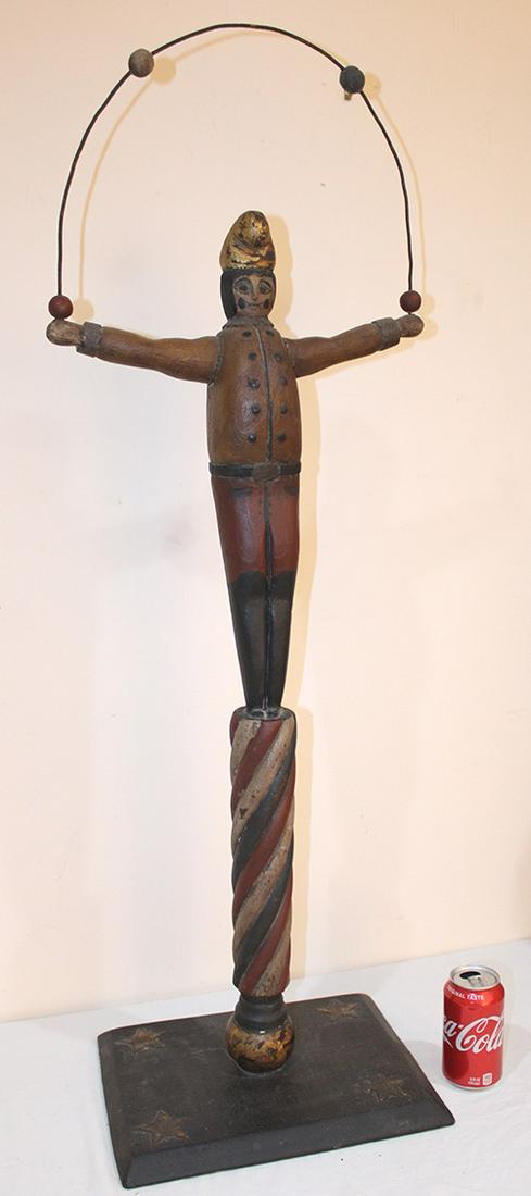 Folk Art 42" Wood Clown Juggling: Folk art 42" wood clown juggling, has most of its paint with stars on the base. 15" wide, 42" tall, 11" deep.