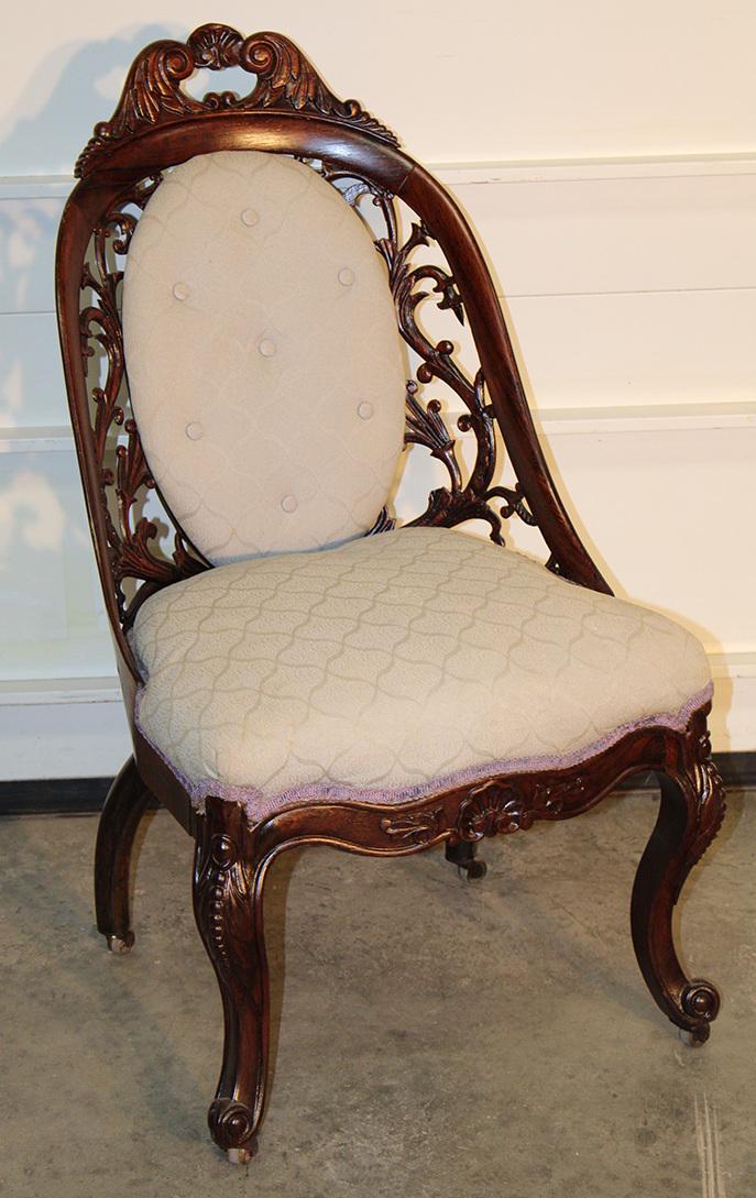 Rosewood Laminated Meeks/Belter Slipper Chair: Rosewood laminated Meeks/Belter slipper chair with fancy pierced carved back all in nice tight condition. 18" wide, 34" tall, 21" deep.