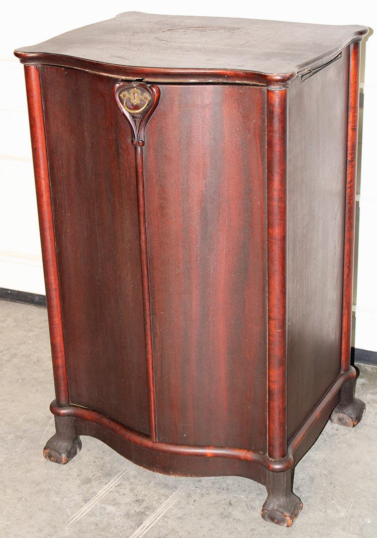Mahogany Serpentine Front Music Cabinet With Claw And Ball Feet: Mahogany serpentine front music cabinet with claw and ball feet. Finish needs sprucing, scratches in the top, no shelves. 22" wide, 34" tall, 18" deep.