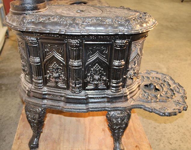 Early Cast Iron Stove By Cox Warren Morrison And Co. Troy 1854 In A Gothic Pattern: Early cast iron stove by Cox Warren Morrison and Co. Troy 1854 in a gothic pattern. Trumph #3, has a small 2" chip and line (see photo) otherwise nice. 16" wide, 22" tall, 29" deep.