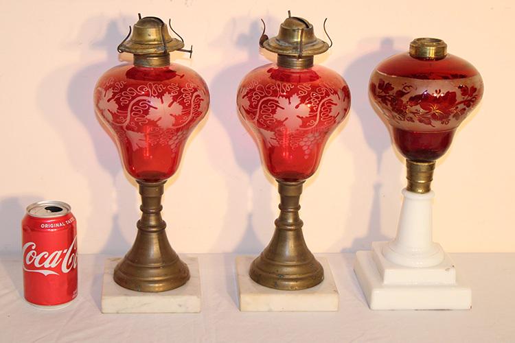 3 Antique Etched Cranberry Oil Lamps: 3 antique etched cranberry oil lamps with marble and milk glass bases. Grape and vine design all in good condition. 5" wide, 14" tall.