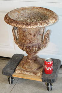 Antique Double Handle Cast Iron Urn: Antique double handle cast iron urn in nice condition, old paint. 16" wide, 19" tall.