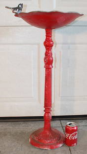 Cast Iron Bird Bath With Iron Bird: Cast iron bird bath with iron bird. Bird just sits on a peg, painted red. 15" wide, 28" tall.
