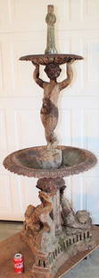 Antique Cast Iron Fountain: Antique cast iron fountain with dolphin base and cupid center, Estate fresh, solid, surface rust. 25" wide, 66" tall.