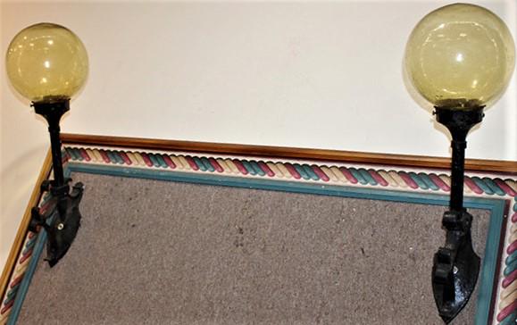 Pair Of Great Arts And Crafts Sconce Lamps: Pair of great arts and crafts sconce lamps with hand blown shades (amber color) with a hand hammered look. Need to be electrified C. 1920-1940's. 8" ball shades in nice condition. 8" wide, 24" tall, 1