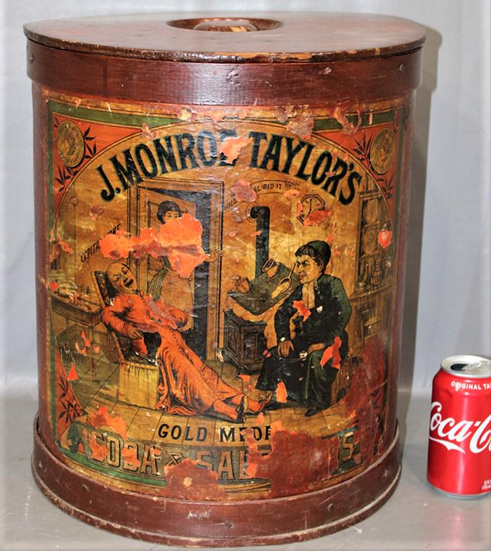 Early J. Monroe Taylor's Soda Store Drum: Early J. Monroe Taylor's Soda Store drum. Original paper litho and lid, gold medal soda and saleratus. Has some chipping on the decal. 14" wide, 16" tall.