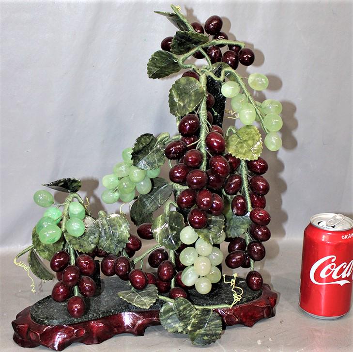 Unusual Glass And Marble Center Piece Of Grape Vines: Unusual glass and marble center piece of grape vines, has marble leaves. 13" wide, 15" tall.