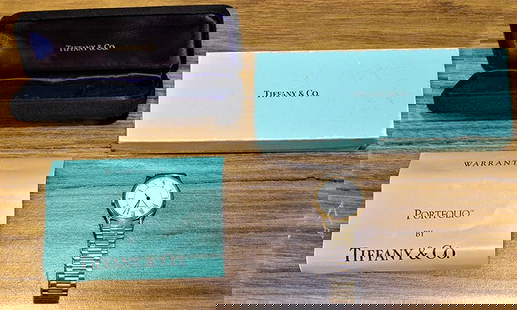 Tiffany "Portfolio" Watch With Original Box: Tiffany "Portfolio" watch with original box. Needs a new crystal.=, no running. I think it needs a new battery, estate fresh.
