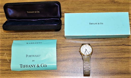 Tiffany "Portfolio" Watch With Original Box: Tiffany "Portfolio" watch with original box. Needs a new crystal.=, no running. I think it needs a new battery, estate fresh.