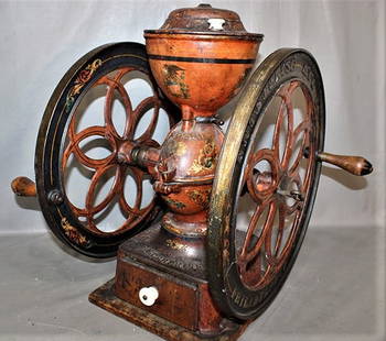 Wonderful Enterprize Coffee Grinder With 17" Wheels In Original Paint: Wonderful Enterprize Coffee grinder with 17" wheels in original paint. I think it is a #7. Has the original drawer and cutter inside. Estate fresh. 18" wide, 22" tall, 17" deep.