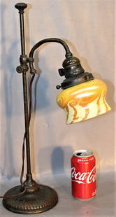 Signed Tiffany Adjustable Student Lamp With Swirl Damascene Shade: Signed Tiffany adjustable student lamp with swirl damascene shade. Original patina marked Tiffany Studios #S.1442. Needs a new socket interior. 12" wide, 20" tall, 6" deep.