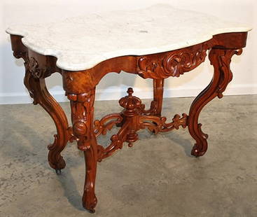 Fancy Rococo Marble Top Turtle Top Table With Nice Pierced Carved Stretcher: Fancy Rococo marble top turtle top table with nice pierced carved stretcher. Marble has a small line (see photo). 37" wide, 30" tall, 25" deep.