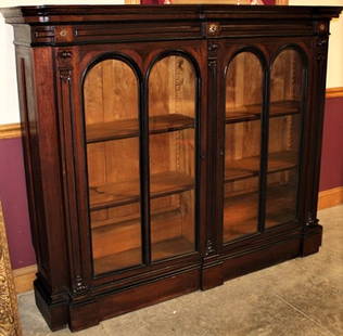 Double Door Walnut 2 Door Bookcase With Black Incising: Double door walnut 2 door bookcase with black incising. Adjustable shelves and paneled sides in nice condition. 66" wide, 54" tall, 14" deep.