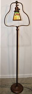 Signed Handel Leaded Floor Lamp With Harp Base: Signed Handel leaded floor lamp with harp base. Multicolored leaded shade (shade is signed). 13" wide, 57" tall, 9" deep.