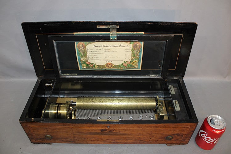 Nice Inlaid 22" 6-Tune Cylinder Music Box: Nice inlaid 22" 6-tune cylinder music box. All teeth are good, strong sound with 11" cylinder. In nice working condition. 22" wide, 6" tall, 9" deep.