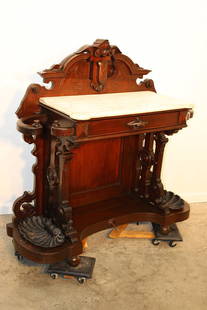 Fancy Walnut Victorian Entrance Way Table And Umbrella Stands: Fancy walnut Victorian entrance way table and umbrella stands. Nice look, slight line in the marble. Has cast iron shell drop pans. 47" wide, 45" tall, 19" deep.