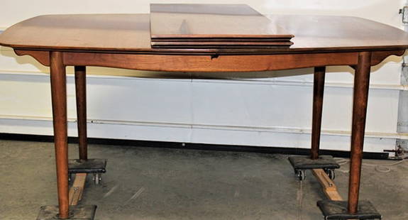 Mid Century Dining Table By Finn Juhl Mfg For Baker: Mid century dining table by Finn Juhl MFG for Baker. Has (2) 20" leaves, opens to 108". Has the crown label underneath. Table is 68" wide, 30" tall, 47" deep.
