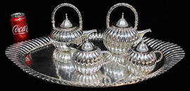 Monumental 10 lb. sterling silver tea set (no monograms) signed Juvento Lopez Reyes. Tray is 25"