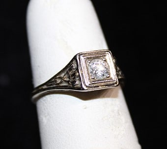 Fancy antique diamond ring in an 18k setting. Fancy reticulated sides, estate fresh. Appr. Size 5. (1 of 4)