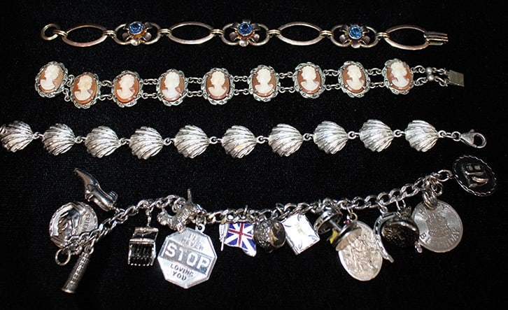 4 fancy estate silver bracelets. (1) with cameos, (1) shells, (1) with lots of charms, (1) Van Dell (1 of 3)