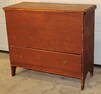 Early 1 drawer lift blanket chest in old red with rose head nails. Snipe hinges, cut out end, and