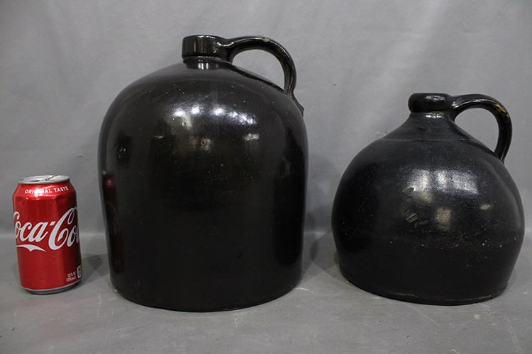 2 early whiskey jugs with a heavy black glaze. Estate fresh in nice condition. Tallest is 11" (1 of 2)