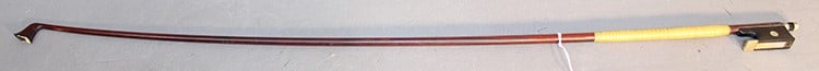 Violin bow marked Tubbs. Weighs 52.7 grams. No string. Appr. 29" long. (1 of 4)