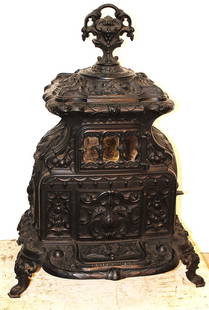 Gothic Cast Iron Ingraham And Phillips 1858 Orient #5 Stove: Gothic cast iron Ingraham and Phillips 1858 orient #5 stove in wonderful condition. Troy, NY. Large fancy finial top. No cracks in the metal. 27" wide, 37" tall, 20" deep.