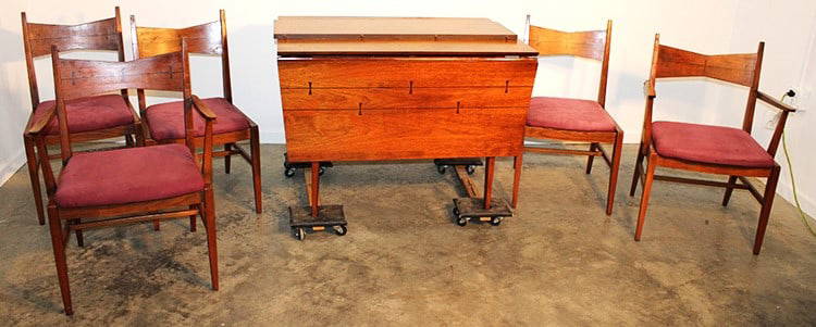 1960's Mid Century Tuxedo Dining Table And 5 Chairs: 1960's mid century tuxedo dining table and 5 chairs. Walnut table with inlaid rosewood bowties. Has drop leaf and 1 extension leaf. Has little wear, consistent with age, Table opens to over 6'.