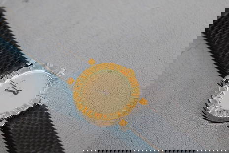 Sweet Signed Tiffany & Co. 14K Ladies Wrist Watch: Sweet signed Tiffany & Co. 14k ladies wrist watch France in nice condition. Looks to be a leather band in the original Tiffany & Co. box. Total length is 7.5". Total weight is 13.4 dwt.