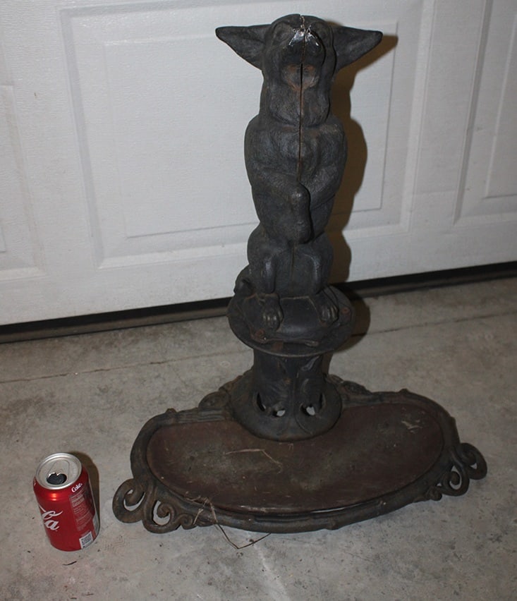Cast Iron Umbrella Stand With Dog: Cast iron umbrella stand with dog. Missing umbrella holder (see photo). 20" wide, 23" tall, 14" deep.