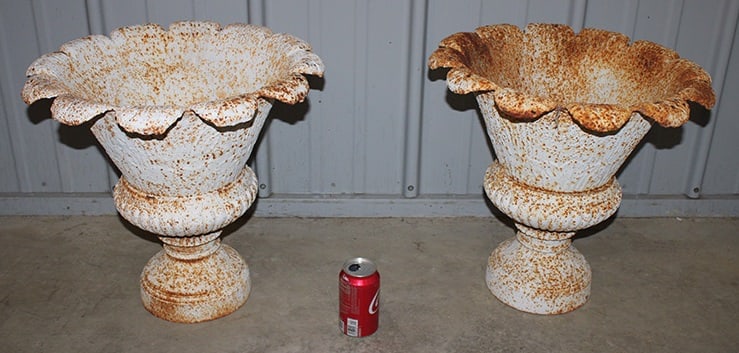 Pair Of Cast Iron Tulip Shaped Urns: Pair of cast iron tulip shaped urns in nice condition with old paint. 19" wide, 17" tall.