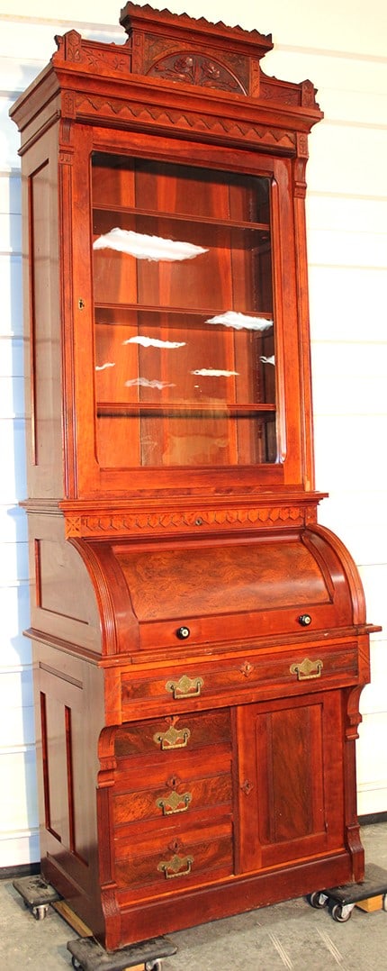 Beautiful Cherry Cylinder Roll Secretary: Beautiful cherry cylinder roll secretary in original finish. Adjustable shelves with a fitted interior, burled accents with a fancy carved crest. 34" wide, 98" tall, 23" deep.