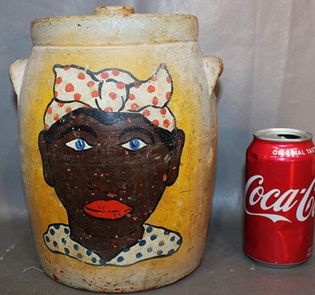 Nice Cookie Jar With Black Nanny Head Painted Antique: Nice cookie jar with black nanny head painted antique. Has wear, but nice condition for its age. No cracks or chips, a couple of small flea bites under the lid. 8" wide, 10" tall.