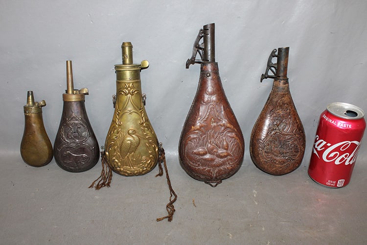 5 Nice Early Powder Flasks (3 Brass, 2 Leather): 5 nice early powder flasks (3 brass, 2 leather). Very unusual ones, estate fresh. Tallest is 10".