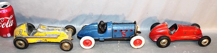 3 Racecars Including Cast Iron #5 Hubley 2 Thimble Drome Specials: 3 racecars including cast iron #5 Hubley 2 Thimble Drome specials. (1) repaint, (1) paint chipping, (1) is a key wind but doesn't work. Estate fresh. Longest is 9".