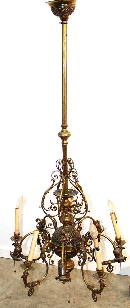 One of the nicest gas and electric brass chandelier. Converted to all electric, 5 candle bulbs up, 5: One of the nicest gas and electric brass chandelier. Converted to all electric, 5 candle bulbs up, 5 arms down. No shades, nice original patina. Estate fresh. 24" wide, 60" tall.