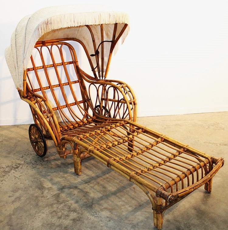 Unusual hooded bamboo chaise lounge in nice condition. A couple of small spots on the upholstery are: Unusual hooded bamboo chaise lounge in nice condition. A couple of small spots on the upholstery are frayed (see photo). Antique, estate fresh and nice. Appr. size is 35" wide, 50" tall, 74" deep.