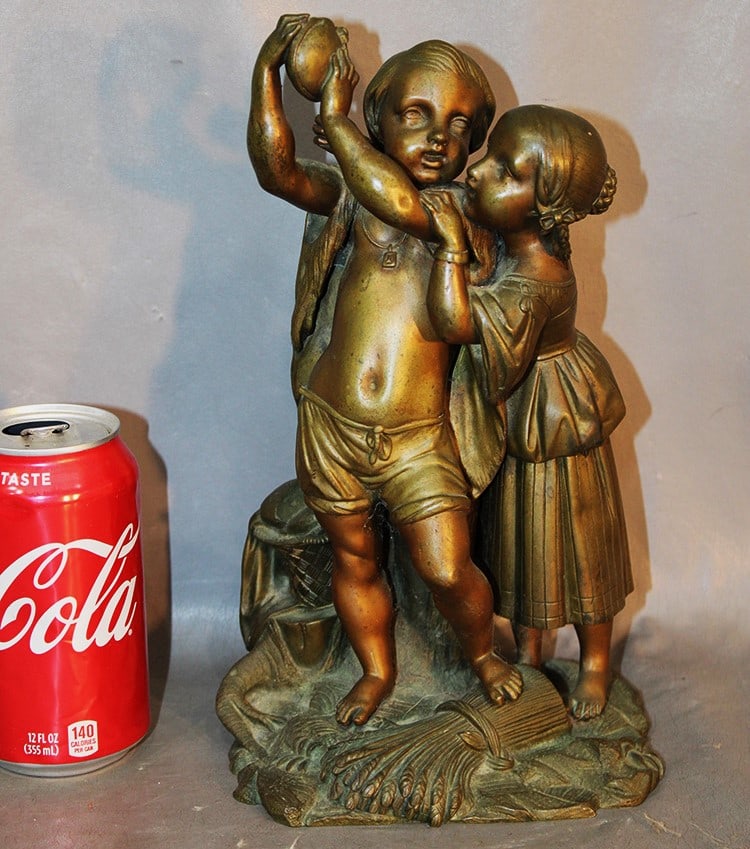 Antique bronze of a boy and girl standing on wheat holding a canteen. Very detailed 2 tone patina,: Antique bronze of a boy and girl standing on wheat holding a canteen. Very detailed 2 tone patina, nice condition. 10.5" tall.