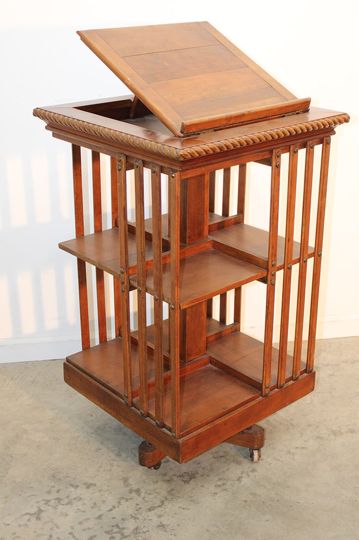 Victorian cherry revolving bookcase. Adjustable book stand on top with a gadrooned edge. Rotates (1 of 3)