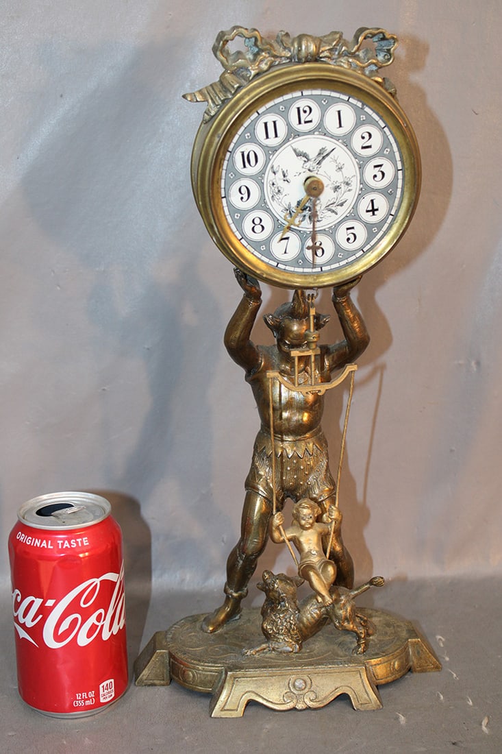 Unusual antique clock with a jester and a cupid swinging pendulum. Springs all good, porcelain face. (1 of 4)