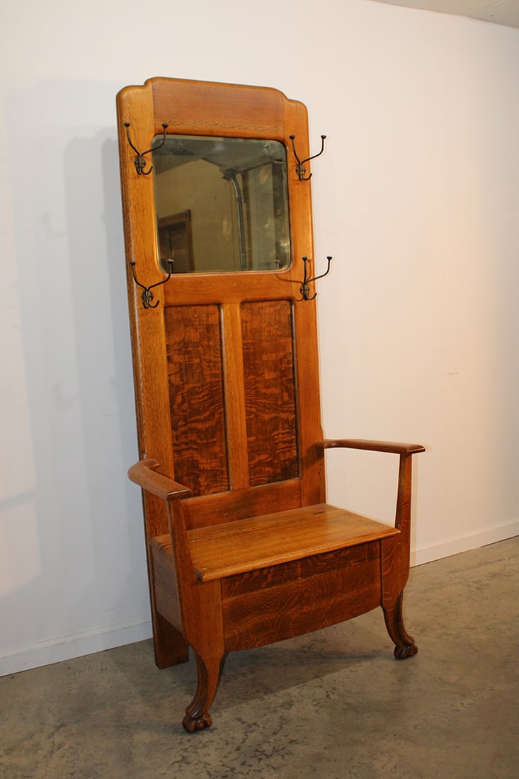 Clean oak lift seat hall tree. Original hooks with claw feet. Estate fresh. 35" wide, 74" tall, 19": Clean oak lift seat hall tree. Original hooks with claw feet. Estate fresh. 35" wide, 74" tall, 19" deep.