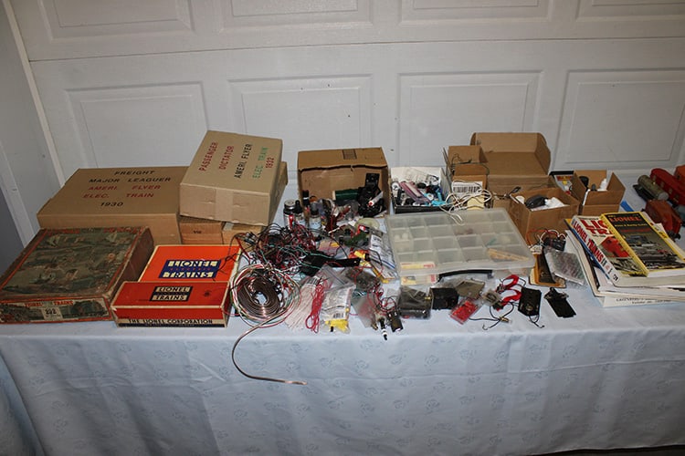 Piles of items to build and repair trains. Also books, boxes from trains, lights, connectors, etc.: Piles of items to build and repair trains. Also books, boxes from trains, lights, connectors, etc. Private collection (deceased).