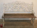 Antique cast iron bench with wooden slats in nice condition. Grape back, good antique. 46" wide, 34"
